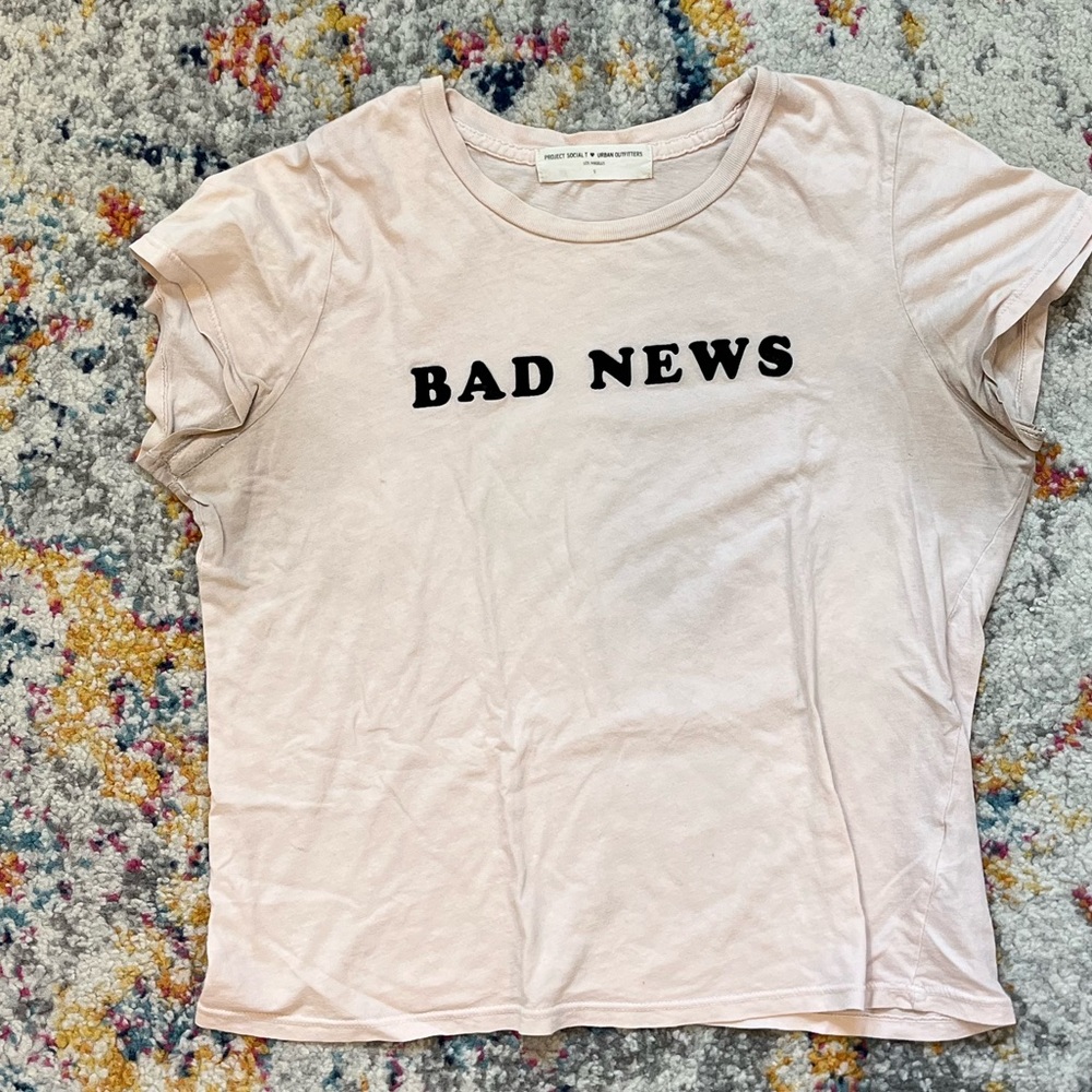 project social T “bad news” tee